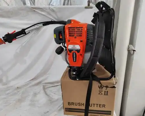 How to replace the electric-start battery of a brush cutter?